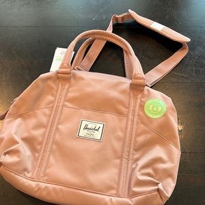 Great rose colored Herschel supply diaper bag w changing pad